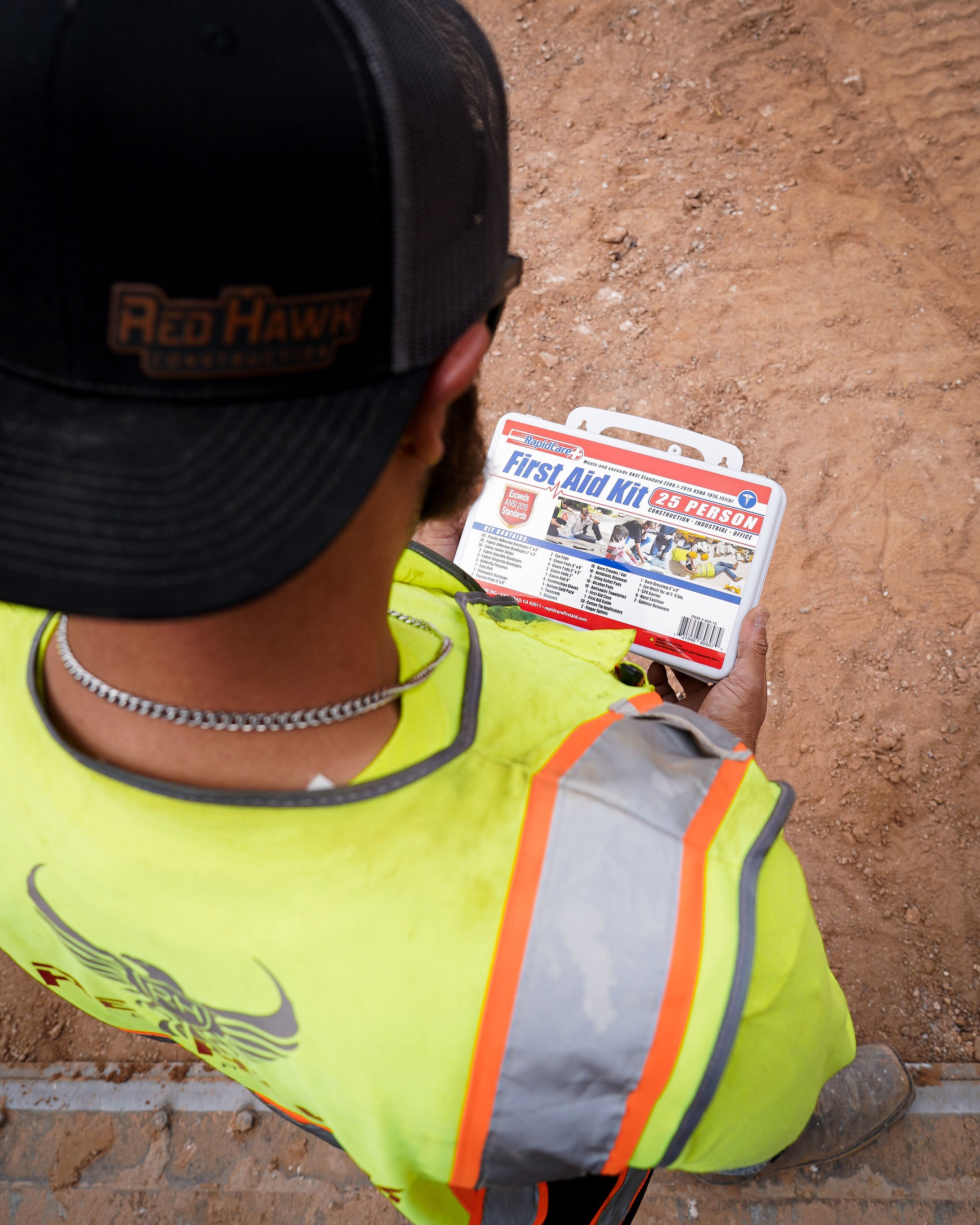 Crew member checking a first aid kit